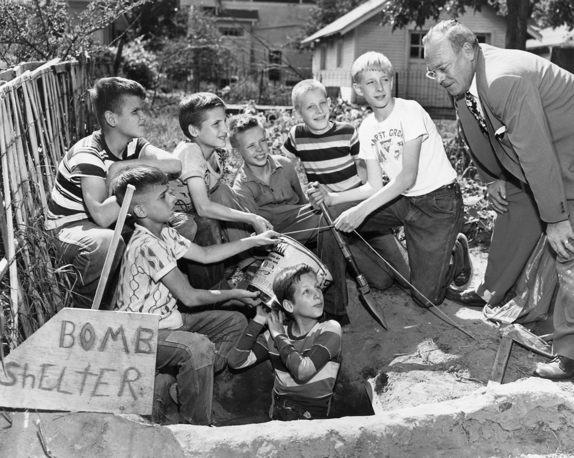 Boys building a bomb shelter in Minnesota during the nuclear anxiety of the Cold War, 1952 